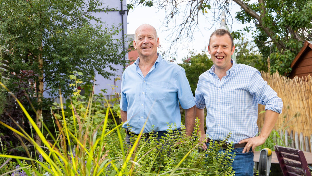 Alistair Wannop and William Tuer standing together in a garden