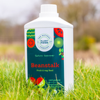 Beanstalk 1L bottle standing in long grass